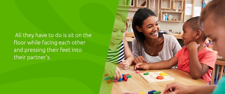 All they have to do is sit on the floor while facing each other and pressing their feet into their partner's.