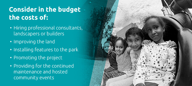 children sitting on end on playground slide