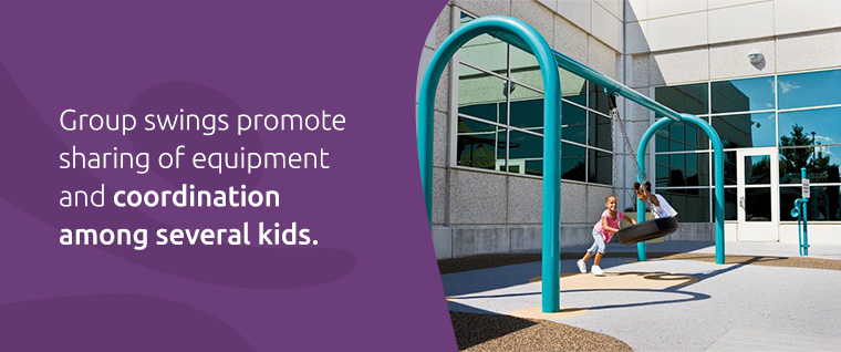 Little girls on tire swing