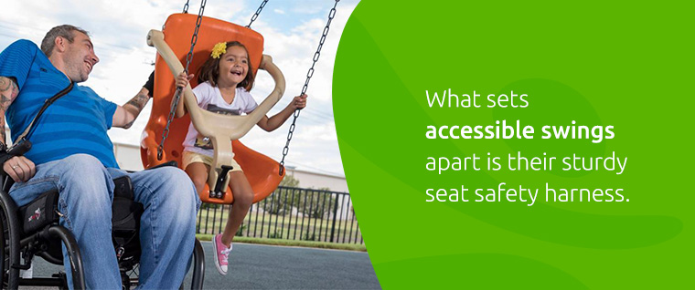 father pushing daugther in accessible swing