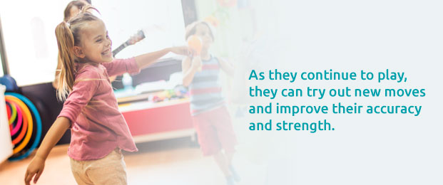 children dancing and playing with instruments