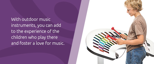 boy playing with concerto outdoor music equipment