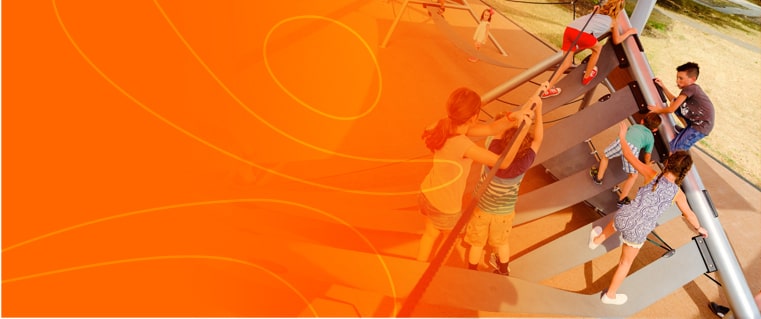 Children on playground climbing structure.