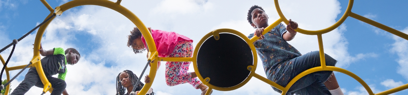 Kids playing on playground climber