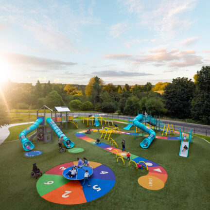 A park playground with a chutes and ladders theme
