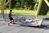Young kids playing on playground equipment