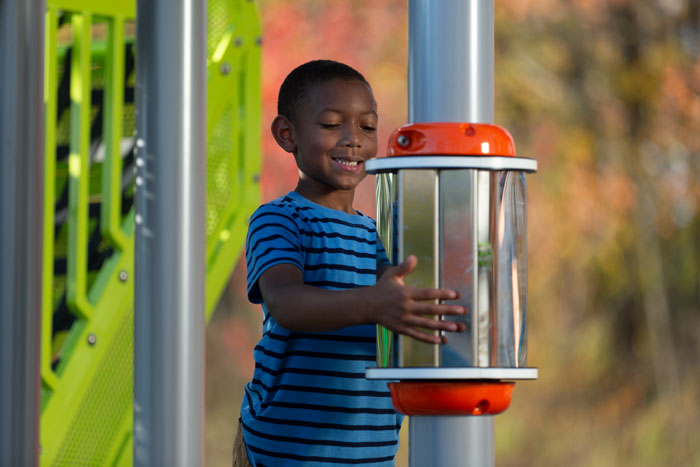 Young boy playing with a spinner