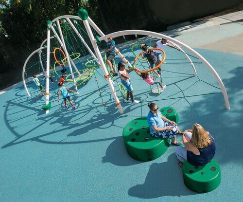 Kids and adults at a playground with a Unity Connect structure
