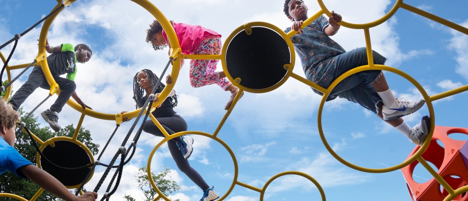 Kids playing on playground climber