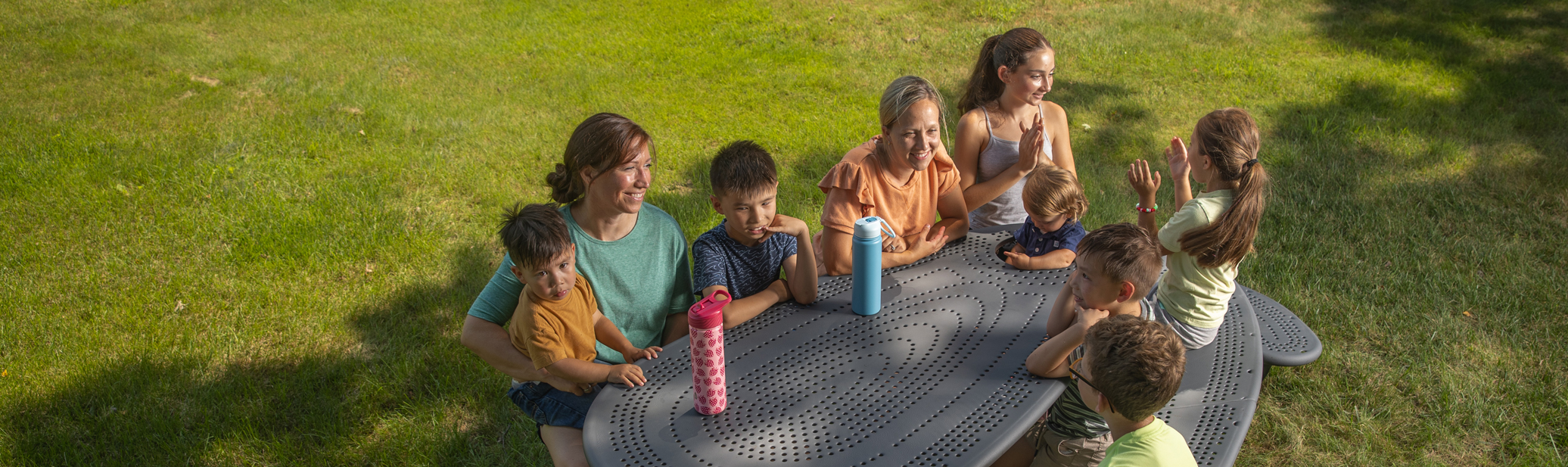 Cross-Generational Family Playing on Playground at the Park