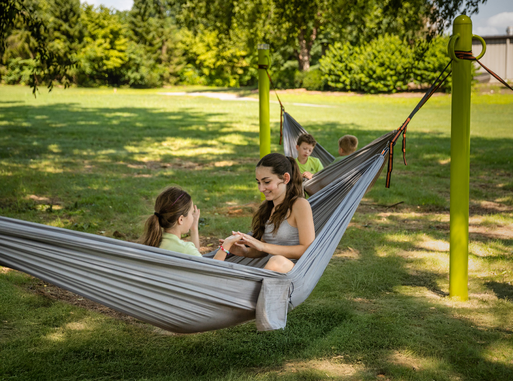 Kids in hammocks in a park
